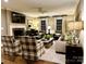 Cozy living room with fireplace, neutral colors, and comfortable seating at 3718 Barclay Downs Dr, Charlotte, NC 28209