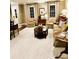 Warm living room featuring plush seating, a cozy rug, and windows offering natural light at 3718 Barclay Downs Dr, Charlotte, NC 28209