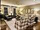 Spacious living room with fireplace, neutral colors, large windows, and stylish decor at 3718 Barclay Downs Dr, Charlotte, NC 28209