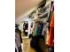 Organized walk-in closet with shelves and hanging rods for ample storage at 3718 Barclay Downs Dr, Charlotte, NC 28209