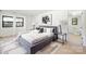 Comfortable bedroom featuring contemporary decor, a large window, and access to the bathroom at 3801 Woodleaf Rd, Charlotte, NC 28205