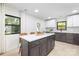 Modern kitchen featuring island seating, stainless appliances, and stylish cabinets at 3801 Woodleaf Rd, Charlotte, NC 28205