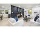 Stylish living room showcasing modern furniture and a unique black accent wall at 3801 Woodleaf Rd, Charlotte, NC 28205