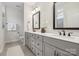 Bright bathroom featuring double vanity, white quartz countertops, and modern fixtures at 4012 Spring Cove Way, Belmont, NC 28012