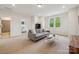 Bonus room with neutral carpet, gray sofa, and natural light at 4012 Spring Cove Way, Belmont, NC 28012