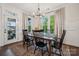 Cozy dining area with wood table, neutral decor, and access to outdoor balcony at 4012 Spring Cove Way, Belmont, NC 28012