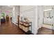 Inviting foyer with hardwood floors, stylish console table, and views of the staircase and other rooms at 4012 Spring Cove Way, Belmont, NC 28012