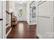 View of the foyer featuring hardwood floors, white trim, and a glass front door at 4012 Spring Cove Way, Belmont, NC 28012