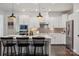 Bright, modern kitchen with stainless steel appliances, granite countertops and kitchen island at 4012 Spring Cove Way, Belmont, NC 28012
