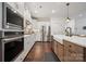 Well-appointed kitchen with stainless steel appliances, farmhouse sink, and modern cabinetry at 4012 Spring Cove Way, Belmont, NC 28012