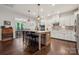 Bright kitchen with island, granite countertops, stainless appliances, and adjoining dining area at 4012 Spring Cove Way, Belmont, NC 28012