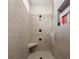 Walk-in shower with tiled walls, rainfall showerhead, and built-in seat at 4012 Spring Cove Way, Belmont, NC 28012