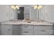 Bathroom featuring dual sinks, granite countertops, and modern lighting at 4109 Arbor Spring Ct, Belmont, NC 28012