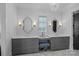 Elegant bathroom featuring dual vanities, granite countertop, and chandelier lighting at 4109 Arbor Spring Ct, Belmont, NC 28012