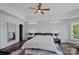 Bright bedroom with hardwood floors, modern ceiling fan, and recessed lighting at 4109 Arbor Spring Ct, Belmont, NC 28012
