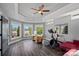 Large bonus room with lake views, exercise equipment, and ample seating area at 4109 Arbor Spring Ct, Belmont, NC 28012