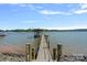 Picturesque boat dock with a covered slip, offering stunning views of the open water and endless aquatic adventures at 4109 Arbor Spring Ct, Belmont, NC 28012