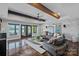 Bright living room with coffered ceilings, fireplace and beautiful views of the lake at 4109 Arbor Spring Ct, Belmont, NC 28012
