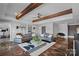 Bright living room features stained concrete floors, exposed beams and modern furniture at 4109 Arbor Spring Ct, Belmont, NC 28012