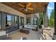Inviting outdoor patio featuring a brick ceiling, a cozy seating area, and a modern fire pit for ultimate relaxation at 4109 Arbor Spring Ct, Belmont, NC 28012
