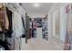 Spacious walk-in closet offering custom shelving and hanging storage at 4109 Arbor Spring Ct, Belmont, NC 28012