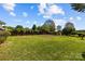 Spacious backyard featuring a well-maintained lawn and a wooden privacy fence and landscaped border at 4705 Granite Ct, Indian Trail, NC 28079