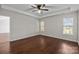 Bedroom features hardwood floors, a ceiling fan, and natural light at 4705 Granite Ct, Indian Trail, NC 28079