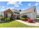 Charming single-story home featuring brick facade, well-manicured lawn, and flowering shrubs at 4705 Granite Ct, Indian Trail, NC 28079