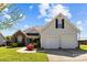 Charming home featuring a brick facade, two-car garage, and a well-manicured lawn at 4705 Granite Ct, Indian Trail, NC 28079