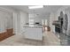 Spacious kitchen with granite countertops and stainless steel appliances leads to the living area at 4705 Granite Ct, Indian Trail, NC 28079