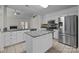 Bright kitchen featuring granite countertops, stainless steel appliances, and a central island at 4705 Granite Ct, Indian Trail, NC 28079