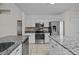 Well-equipped kitchen with granite counters, stainless steel appliances, and ample cabinet space at 4705 Granite Ct, Indian Trail, NC 28079