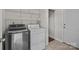 Laundry area featuring washer, dryer, shelving, and tile floor at 4705 Granite Ct, Indian Trail, NC 28079
