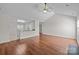 Open living area featuring hardwood floors seamlessly connects to the well-appointed kitchen at 4705 Granite Ct, Indian Trail, NC 28079