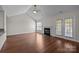 Bright living room featuring hardwood floors, a fireplace, and access to an outdoor patio at 4705 Granite Ct, Indian Trail, NC 28079