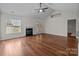 Spacious living room with fireplace, vaulted ceiling, and hardwood floors at 4705 Granite Ct, Indian Trail, NC 28079