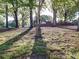 Expansive backyard dotted with mature trees provides plenty of space for recreation and outdoor enjoyment at 4903 Walt Gay Rd, Monroe, NC 28112