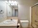 This bathroom features a single sink vanity with a mirror and shower with glass door at 4903 Walt Gay Rd, Monroe, NC 28112
