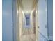 Hallway featuring wood-look flooring, with linen closet and seamless transition between rooms at 4903 Walt Gay Rd, Monroe, NC 28112