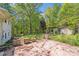 Backyard with patio, trees, and outbuilding at 4915 Huntington Farm Rd, Catawba, SC 29704
