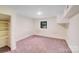 A simple bedroom with carpet, a closet and a small window at 4915 Huntington Farm Rd, Catawba, SC 29704