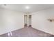 A bedroom featuring neutral walls, carpet, closet space, and open doorway at 4915 Huntington Farm Rd, Catawba, SC 29704