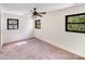 Bright bedroom featuring neutral walls, carpet, and ceiling fan with natural light from multiple windows at 4915 Huntington Farm Rd, Catawba, SC 29704