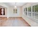 Bright dining room with wood floors, white shutters, and stylish chandelier at 4915 Huntington Farm Rd, Catawba, SC 29704