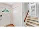 Entryway and stairway featuring white walls, wood accents, and bright lighting at 4915 Huntington Farm Rd, Catawba, SC 29704