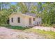 Exterior view of the home and yard with bright sunny skies and surrounding trees at 4915 Huntington Farm Rd, Catawba, SC 29704