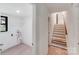 Hallway with laundry room to the left and a staircase in front at 4915 Huntington Farm Rd, Catawba, SC 29704