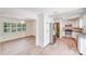 Bright kitchen boasts stainless appliances, granite counters, white cabinets and wood-look floors at 4915 Huntington Farm Rd, Catawba, SC 29704