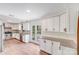 Bright kitchen features white cabinets, granite countertops, and a stainless steel dishwasher at 4915 Huntington Farm Rd, Catawba, SC 29704