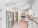 Spacious kitchen featuring white cabinets, stainless appliances, and wood-look floors at 4915 Huntington Farm Rd, Catawba, SC 29704